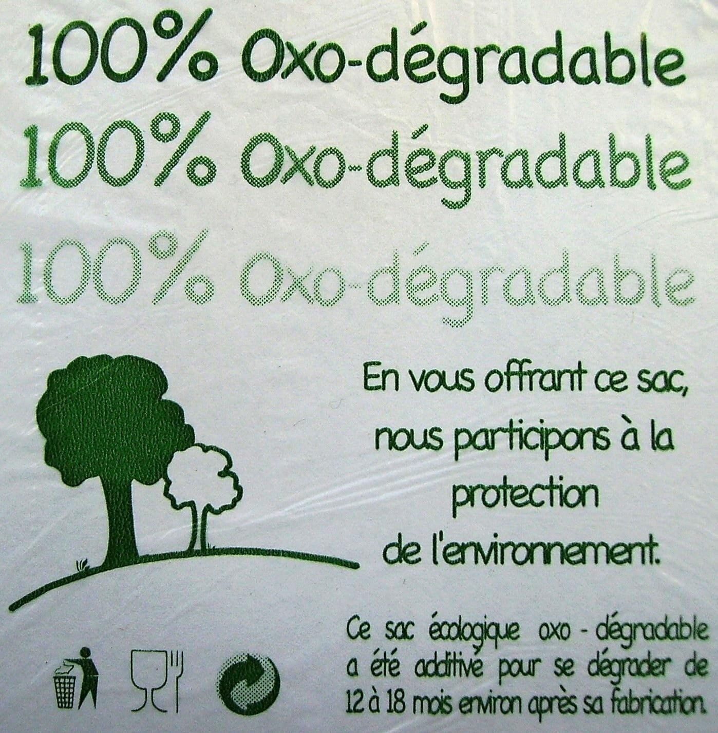 bioaqualife: A label showing "100% Oxo-dégradable" text repeated three times and information in French about environmental protection. It includes green graphics of trees, a recycling logo, and a note on the bag's degradability timeline of 12 to 18 months.